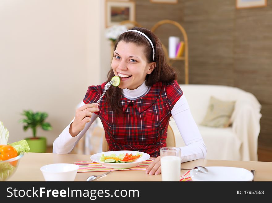 A Young Girl Cooking At Home