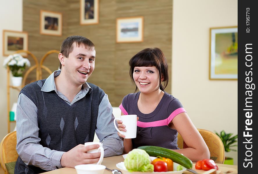 Young couple in love at home eating together and having fun. Young couple in love at home eating together and having fun