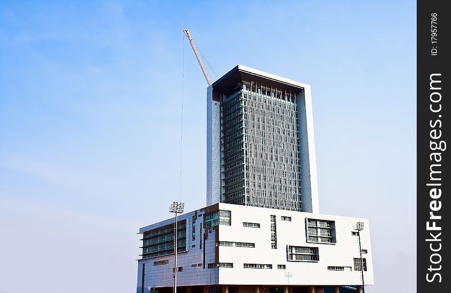 Crane and building under construction on the skyline