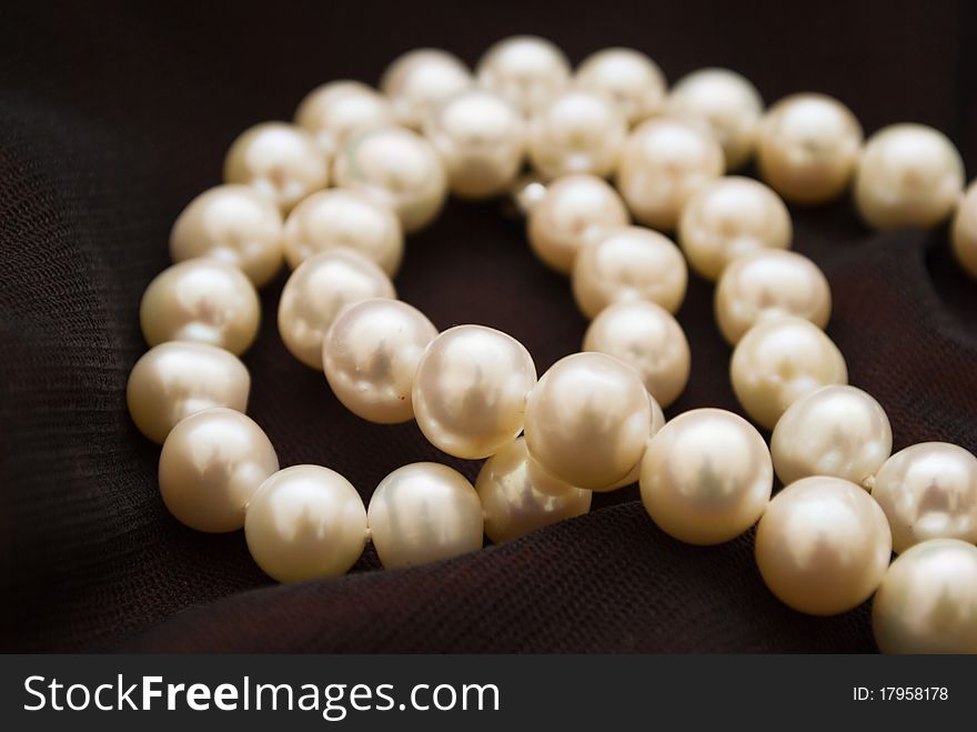 White pearls in black background