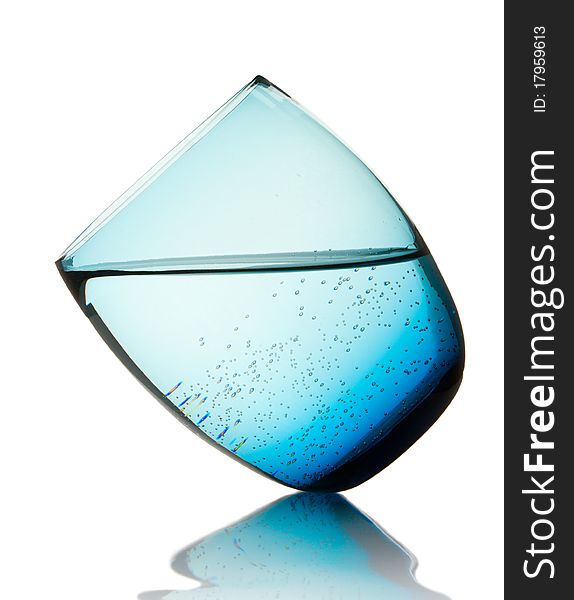 Glass with pure mineral water  and  bubbles on white. Glass with pure mineral water  and  bubbles on white