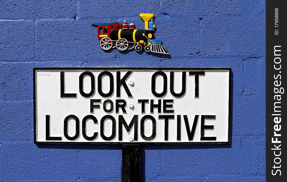 Look out for the train antique enamel sign