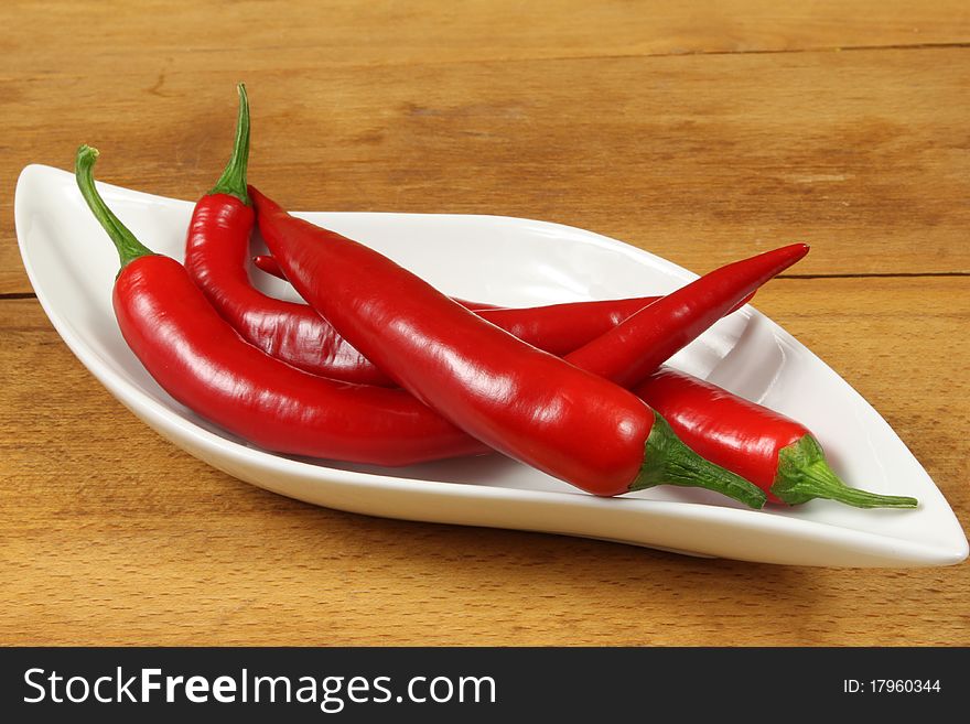 Fresh red cayenne peppers. Vegetables isolated on white.