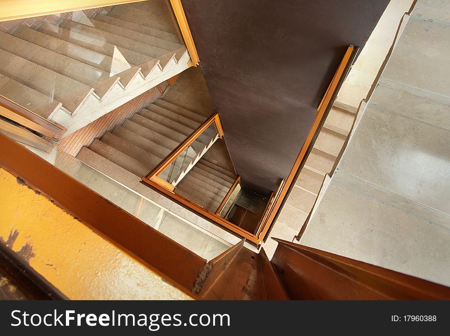 Interior of a building, view on stairs and big brown wall. Interior of a building, view on stairs and big brown wall.