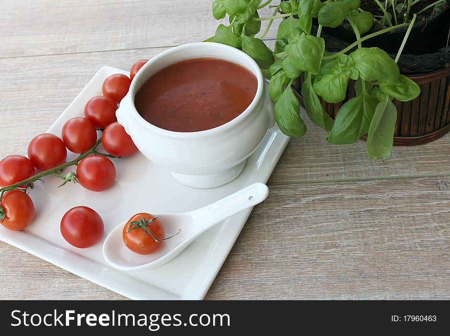 Vegetarian cuisine with basil and tomato soup