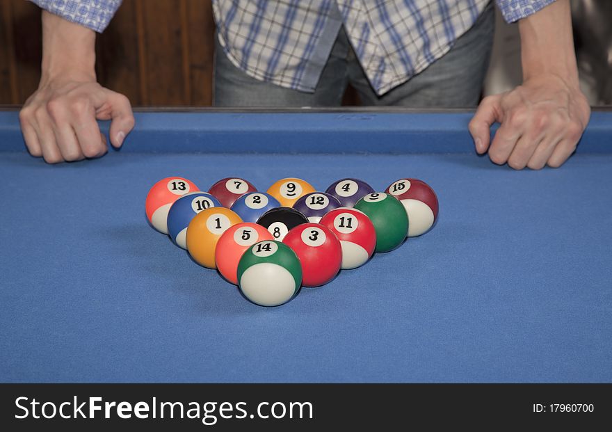 Man in front of the billiard balls