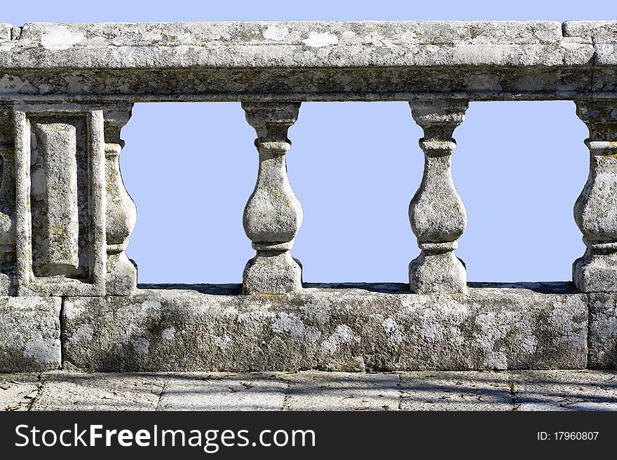 Old stone railing on a blue background