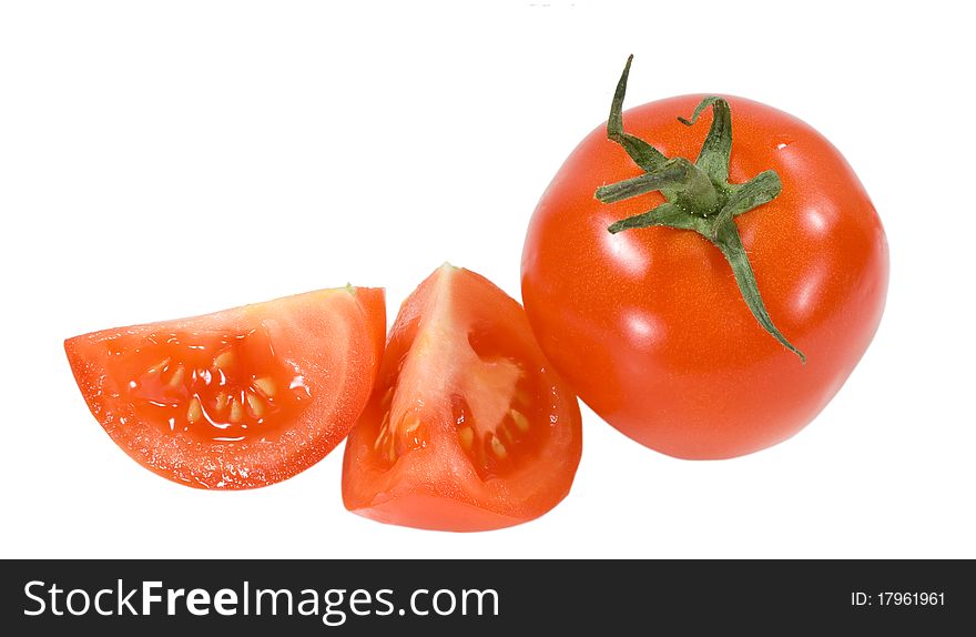 Red tomato with two cropped segments isolated on the white background