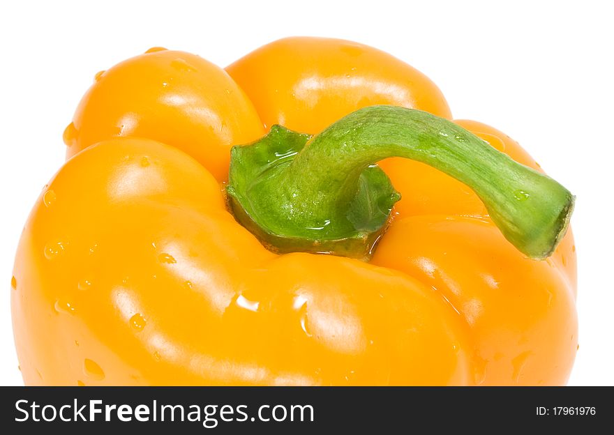 Orange pepper with drops of water isolated on the white