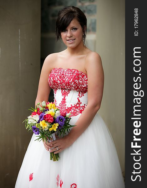 Beautiful bride holding a bouquet of flowers. Beautiful bride holding a bouquet of flowers