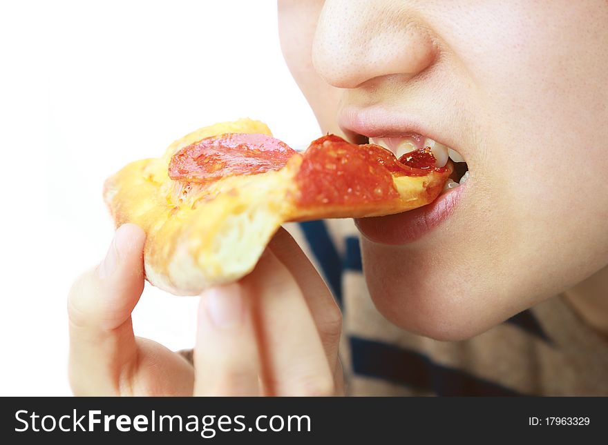 Woman eating pizza on white background