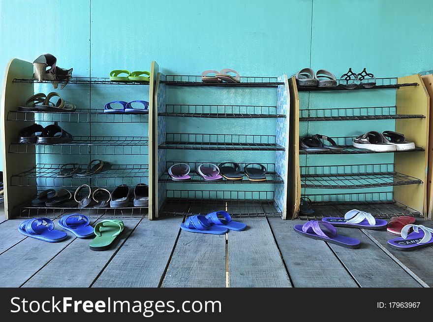 Shoe shelf with green background