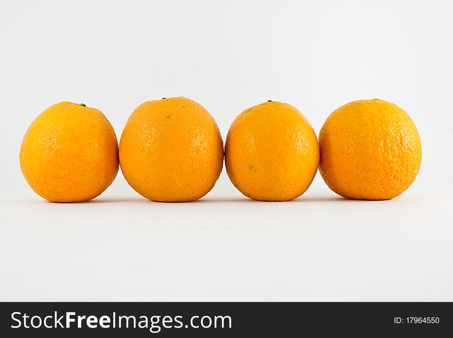 A row of oranges over white background