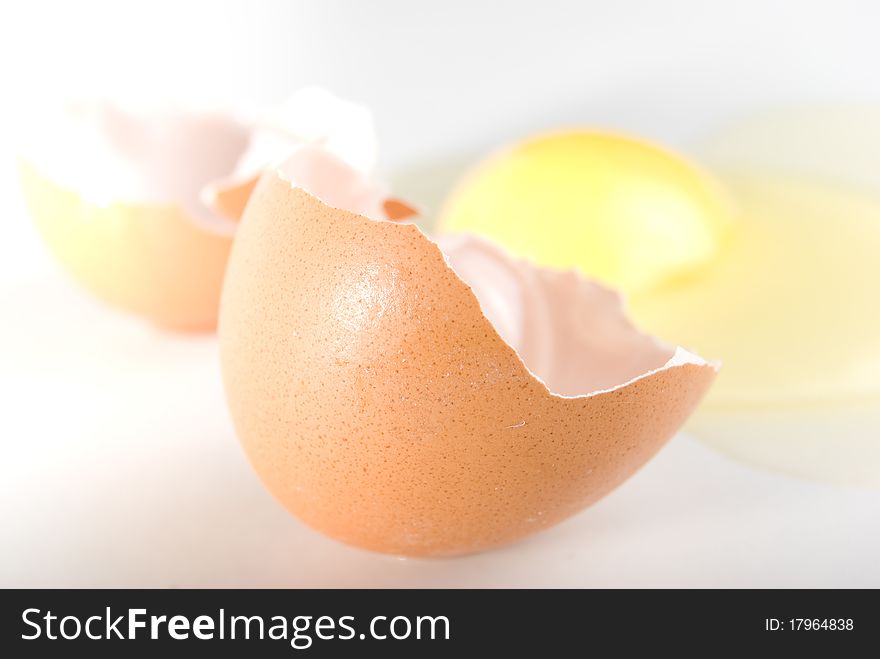 The broken egg on the white background