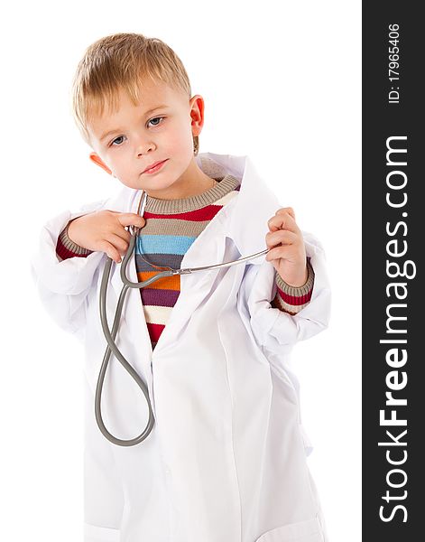 A cute boy is portraying a doctor. isolated on a white background