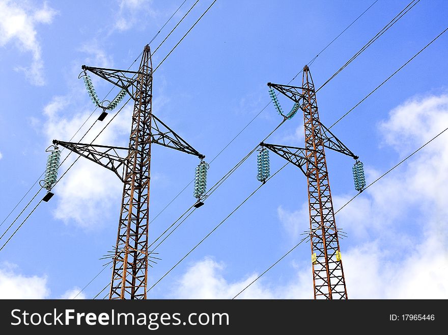 Pylons with blue sky and white clouds. Pylons with blue sky and white clouds