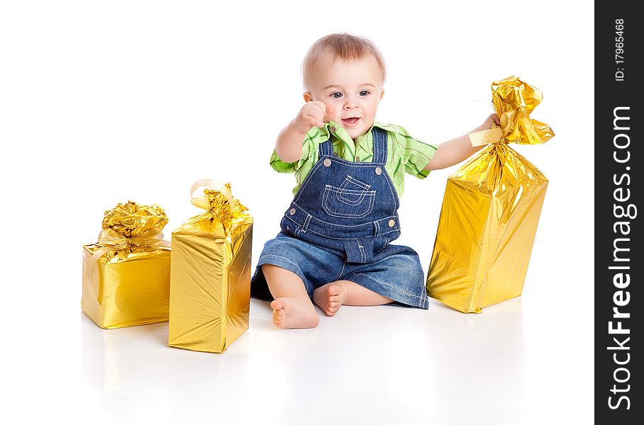 Small boy with three gifts in bright packaging. isolated on a white background