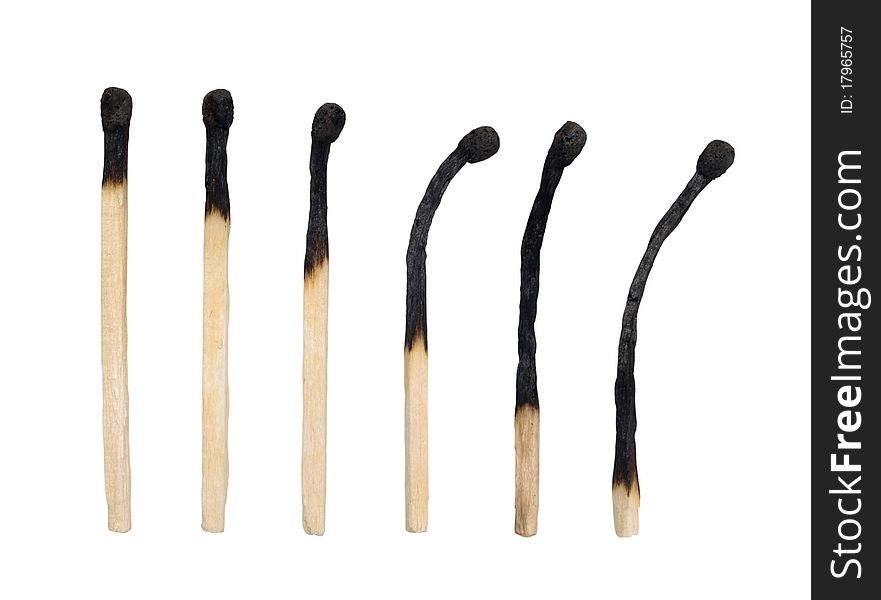 Closeup of a group of burned matches isolated on white