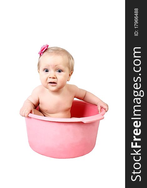 Disturbance small child having bath in pink tub isolated