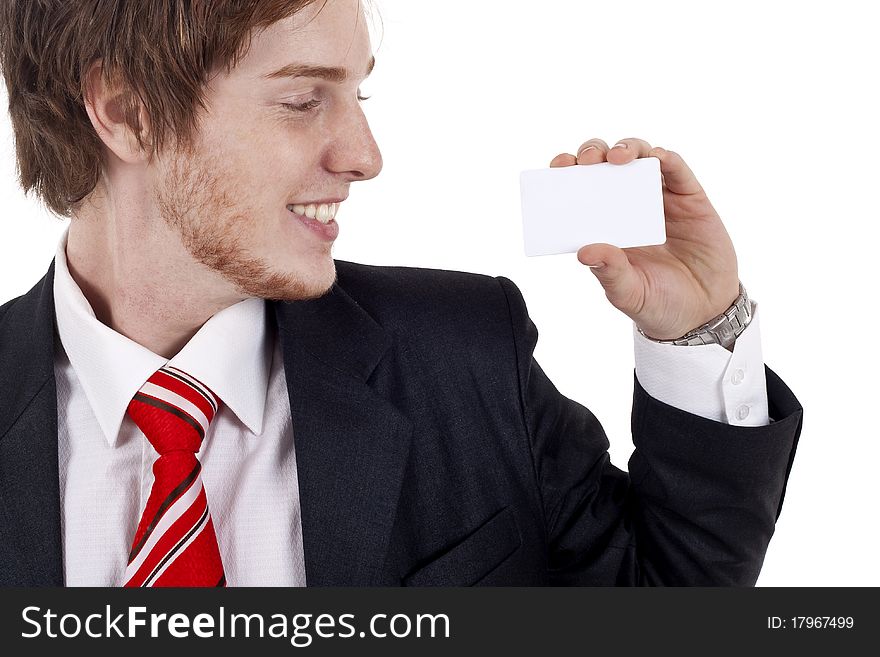 Smiling business man presenting a white business card. Smiling business man presenting a white business card