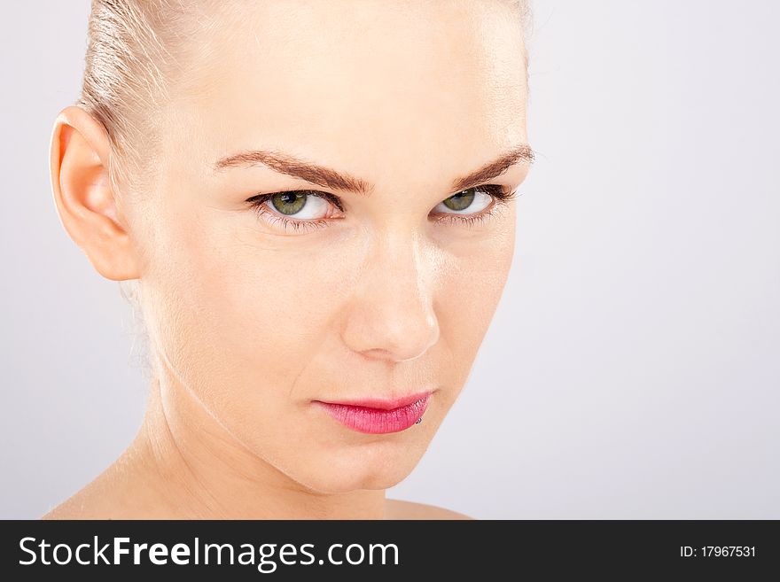 Close up of o beautiful blonde woman with green eyes. Close up of o beautiful blonde woman with green eyes