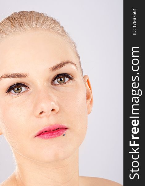 Close up of a beautiful blonde woman, smooth skin. Close up of a beautiful blonde woman, smooth skin