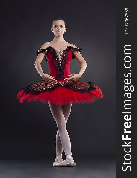 Ballerina posing over black