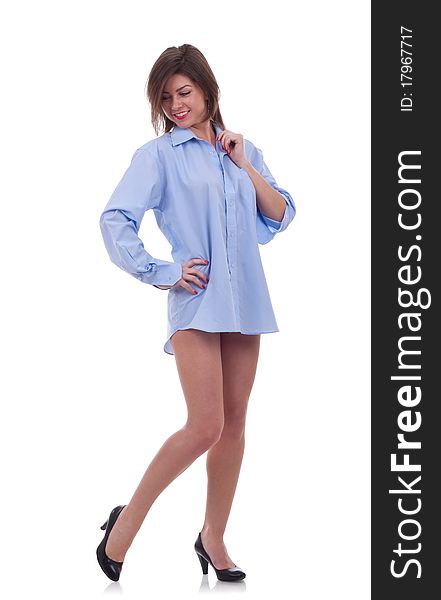 Pretty young woman in a blue men's shirt , over white