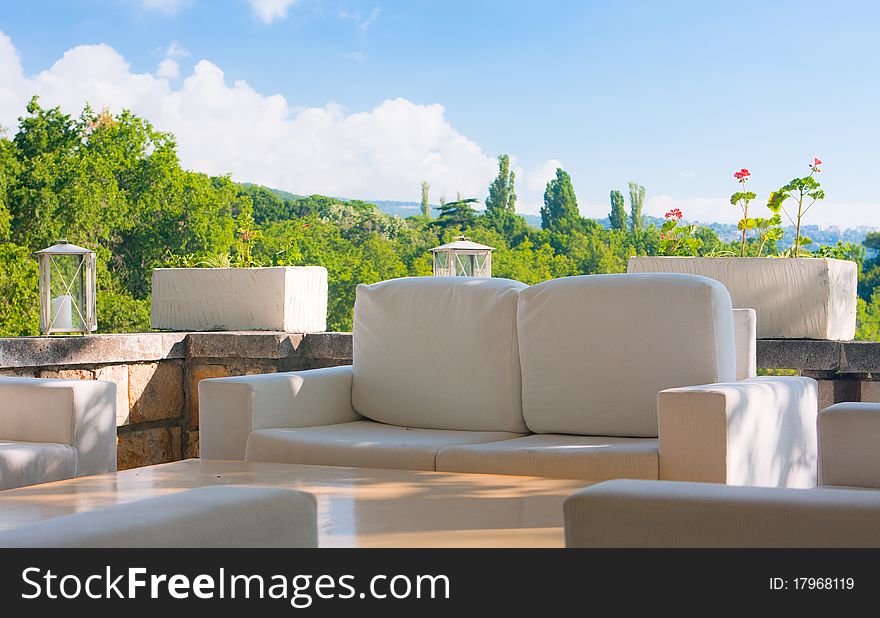 Summer Arbour With A Soft Sofa And Table