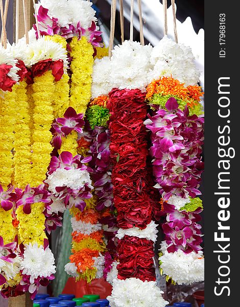 Different types of flower garlands or rosaries hung up at a Thaipusam celebration