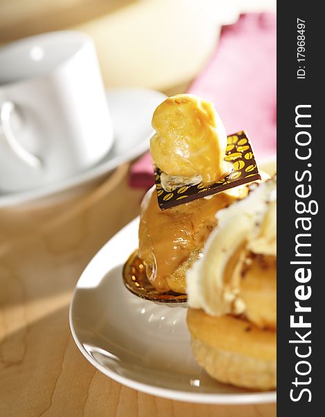 A selection of dessert pastries in a table setting. A selection of dessert pastries in a table setting