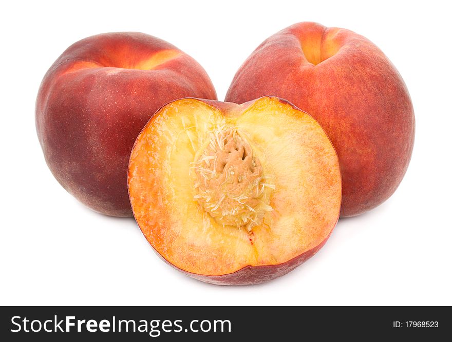 Close-up heap of ripe peaches, isolated on white