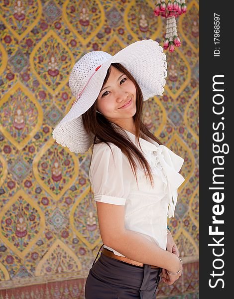 Smiling young thai girl on the thai paint background. Smiling young thai girl on the thai paint background