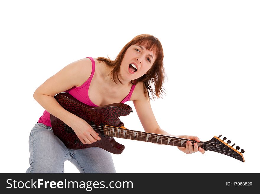 A beautiful young woman is playing a guitar. A beautiful young woman is playing a guitar