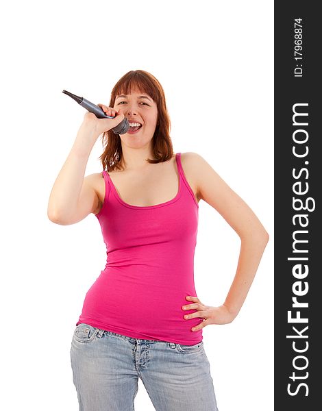 A beautiful young woman with a microphone in her hand. A beautiful young woman with a microphone in her hand