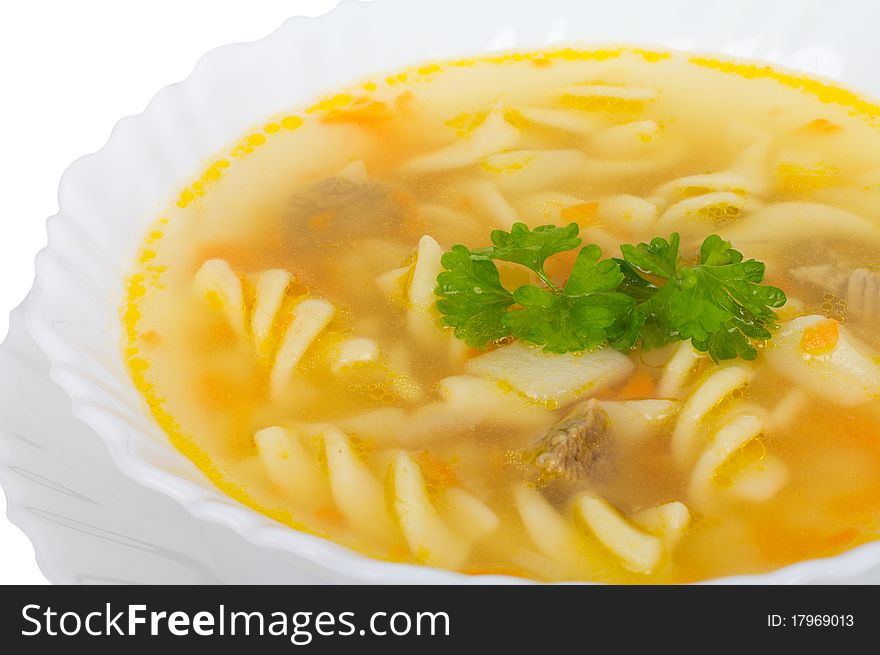 Close-up soup with macaroni and meat, isolated on white