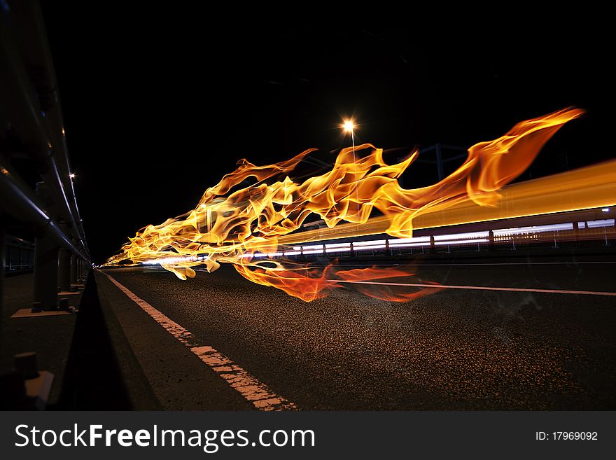 Afterimage of the flame leaves the road at night. Afterimage of the flame leaves the road at night