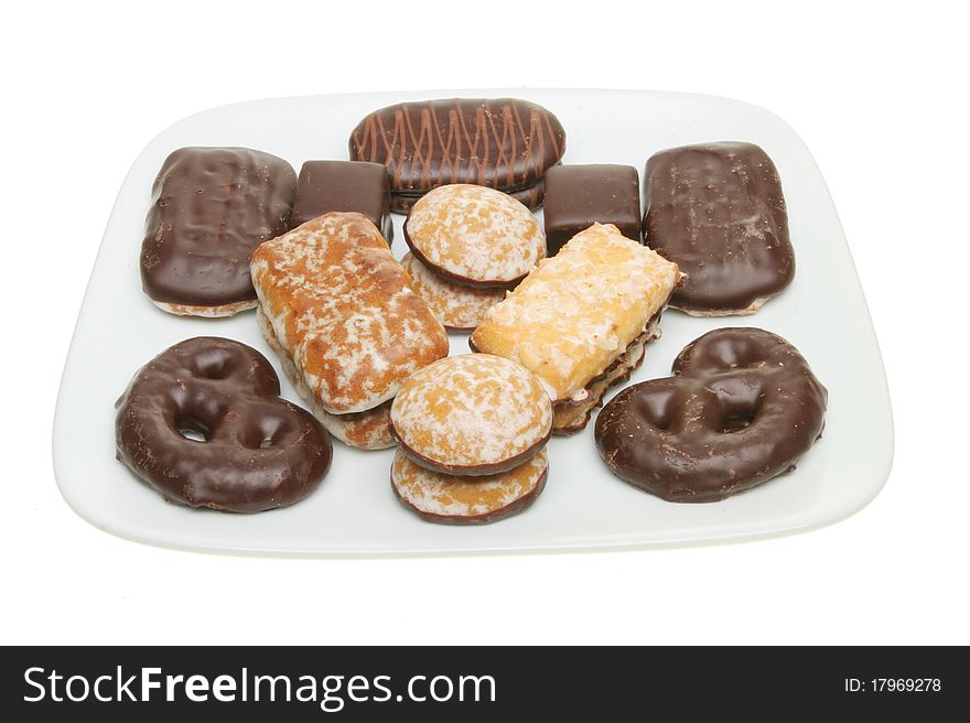 Selection of Lebkuchen continental biscuits on a plate isolated against white. Selection of Lebkuchen continental biscuits on a plate isolated against white