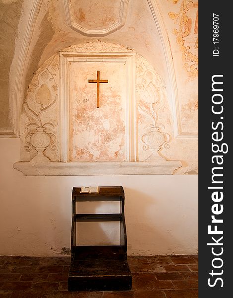 Holy bible on an empty chapel bench