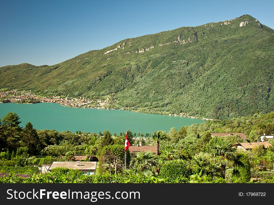 View on blue lake and green mountains on summer. View on blue lake and green mountains on summer