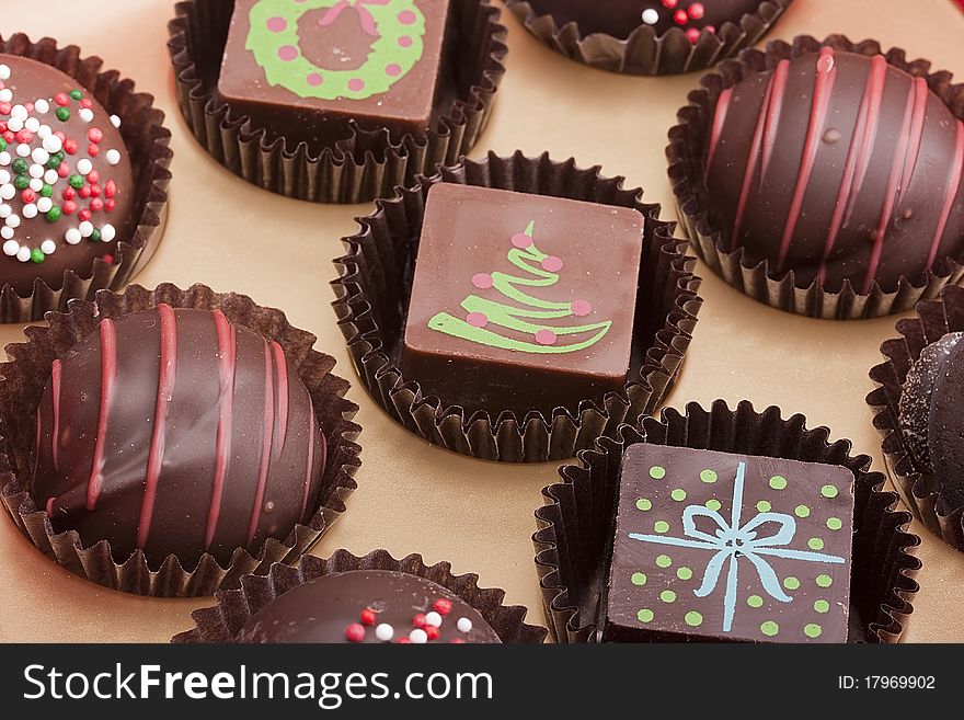 Set of chocolate candies with a decorative ornament.