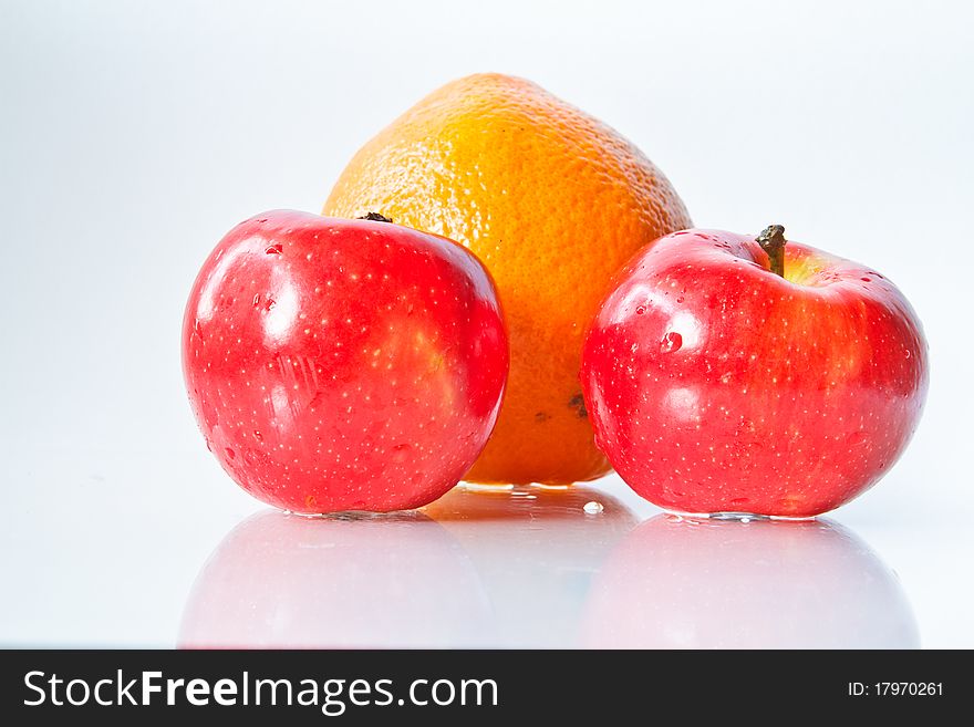 Food Related: Apples and Orange Isolated on a White Background