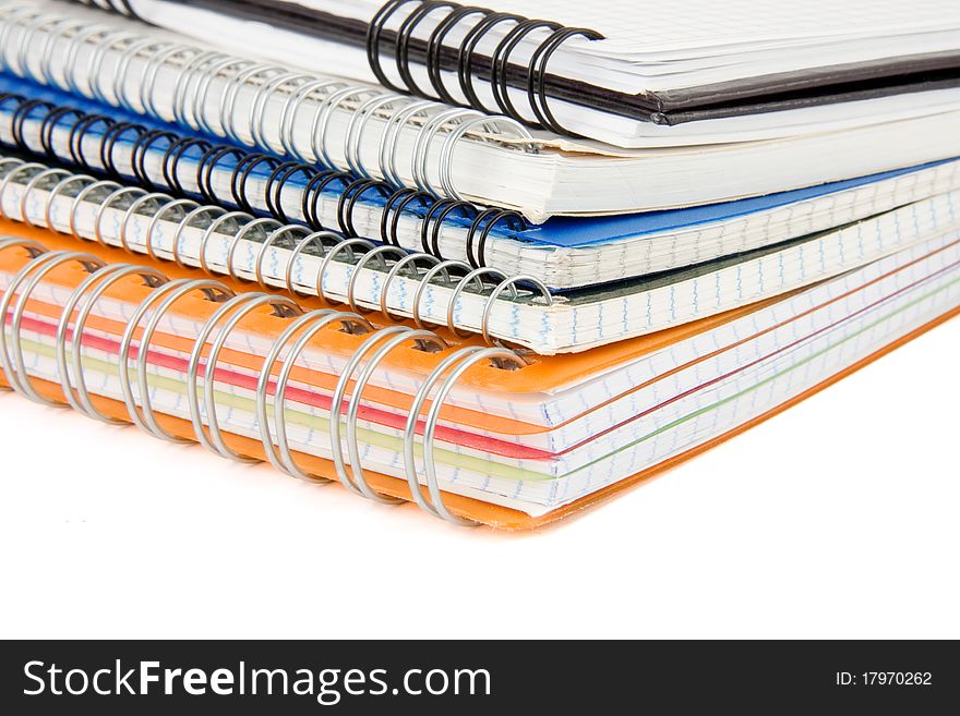 Pile of checked notebook isolated on white