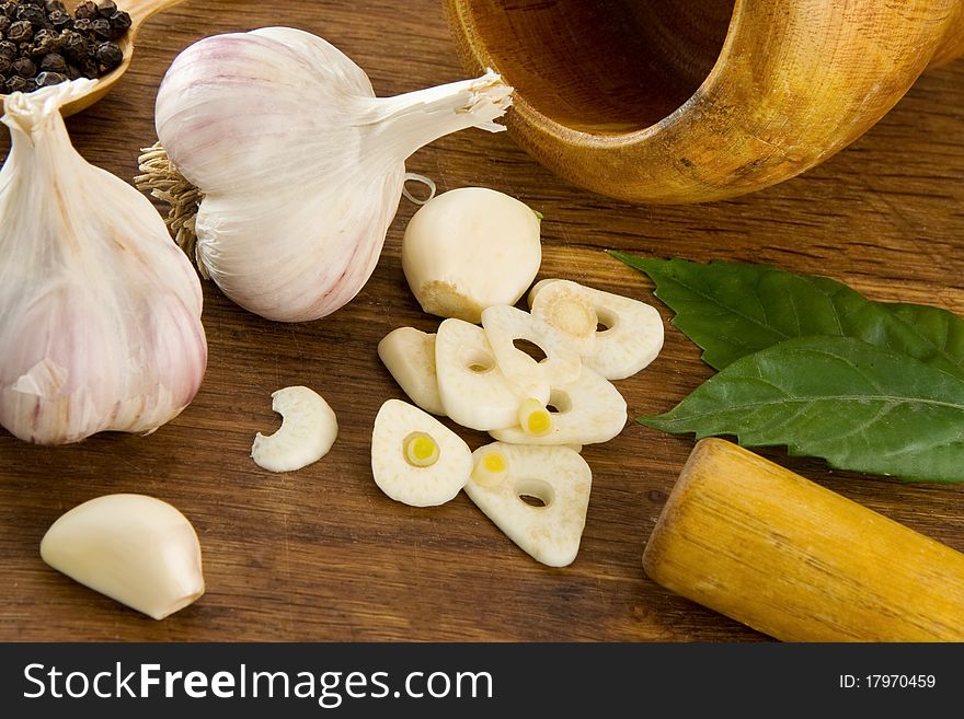 Set of garlic and spice on wooden texture