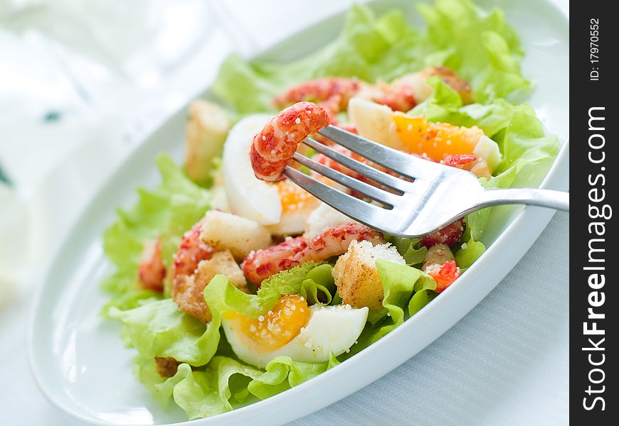 Fresh salad with shrimp and egg for appetizer
