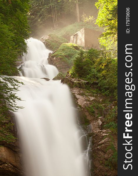 View on waterfall Giessbachfall and green forest, Switzerland