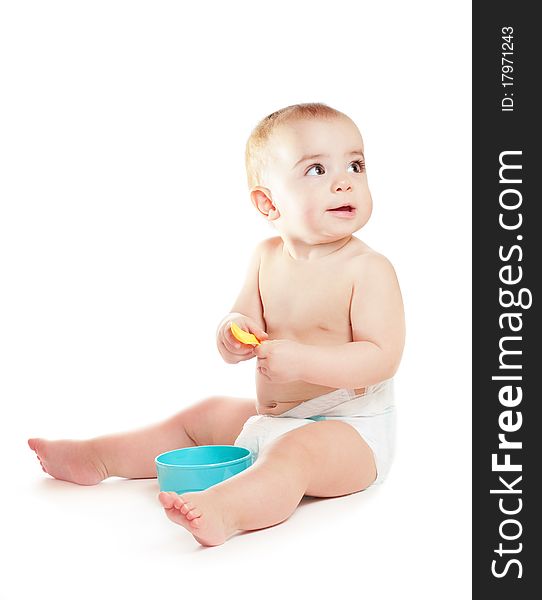 Small beautiful baby girl with yellow spoon on a white background