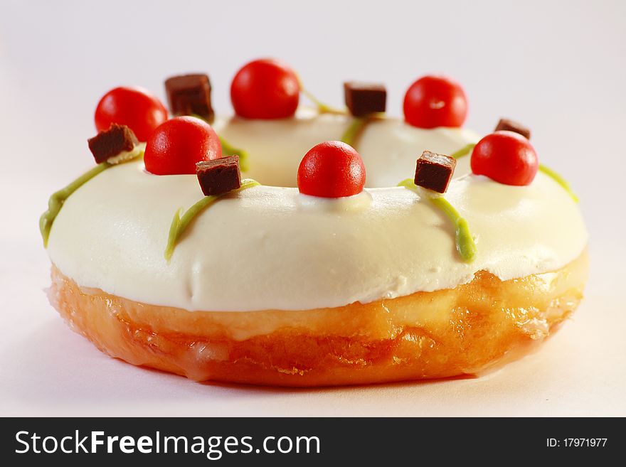 Delicious white doughnut with amzing topping, close up