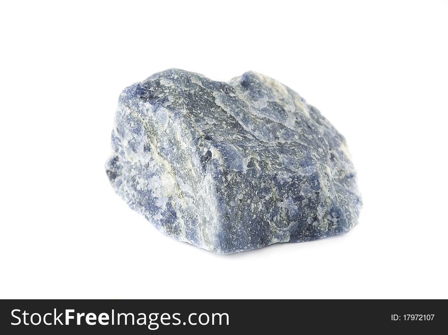 Raw semiprecious blue stone sodalite isolated on white background. Raw semiprecious blue stone sodalite isolated on white background