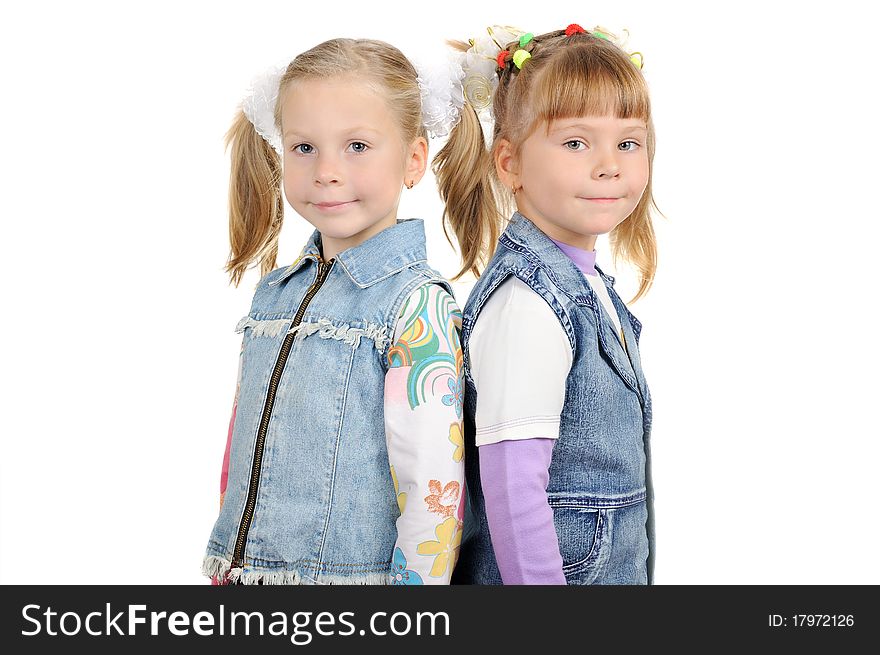 Two smiling girls look at camera.Isolated on the white